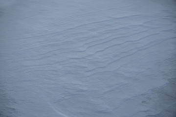Natural winter background with snow drifts