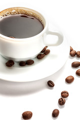 Coffee cup with beans isolated on white