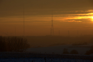 Sunrise over snow covered fields in Belgium