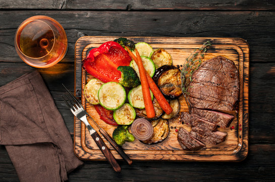 Slices of beef steak with grilled vegetables and brandy