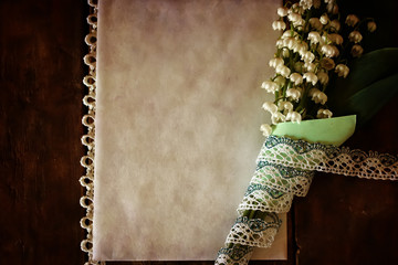 vintage effect on photo bouquet of lilies of the valley and spac