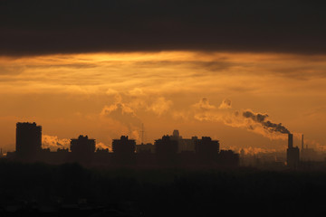 Smoke from industrial chimneys at dawn