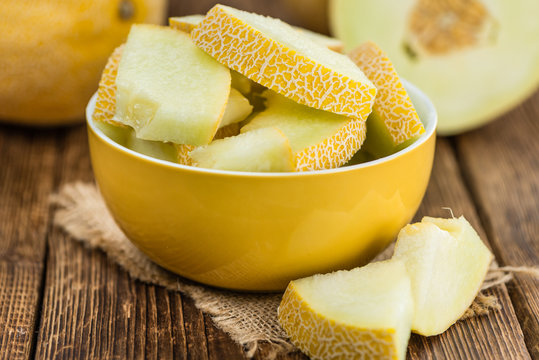 Wooden table with Honeydew Melon (selective focus)