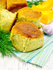 Scones pumpkin with garlic and dill on towel