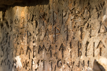 Inscription on old tomb in the Greek language. Characters, symbols. Hieroglyphs