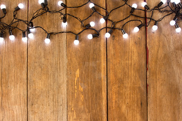 Christmas rustic background - old wood bakcground with lights an