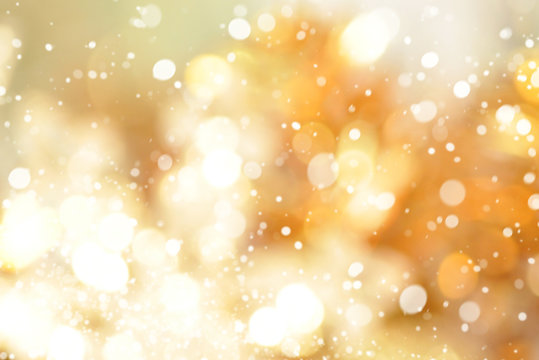 Abstract bokeh gold background with snow