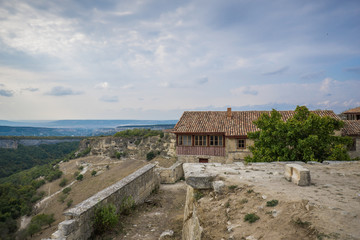 Fototapeta premium Old stone houses of the medieval town Chufut-Kale in the mountains