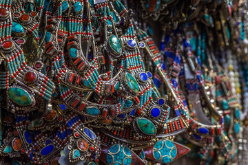 Many necklaces with coral and turquoise on the market stall