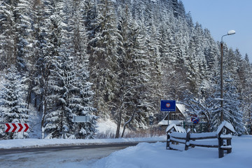 Polish-Slovak border post on the Lysa Polana in snowy forest in the High Tatras mountains. Border crossing on the road from Zakopane (Poland) to Tatranska Lomnica (Slovakia). © Renar