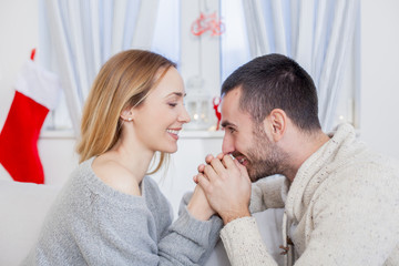 Young couple in love on Christmas night