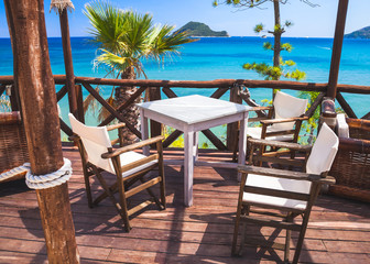 Seaside balcony with wooden furniture