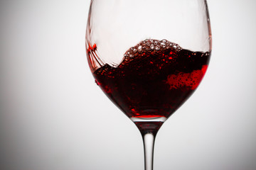 Excitement of wine in glass goblet