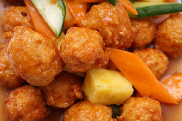 Chinese food. Sweet and sour meatballs with pineapple