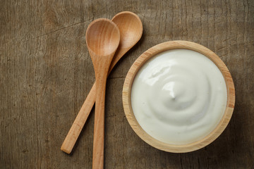 Greek yogurt on wooden background