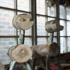 Making wooden reindeers from the logs in the shed, selective focus, square