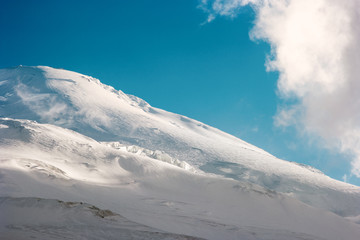 Fototapeta na wymiar Elbrus Mountain glacier Landscape Travel serene scenic view blue sky and clouds
