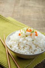 Japan rice with chopsticks on a fabric mat