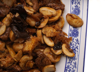 Veal with black and white mushrooms and bamboo shoots