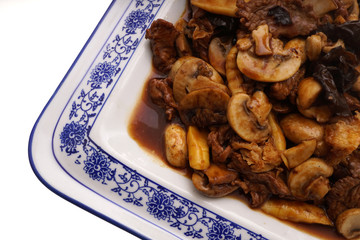 Veal with black and white mushrooms and bamboo shoots