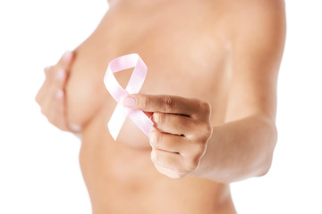 Topless woman with pink breast cancer ribbon.