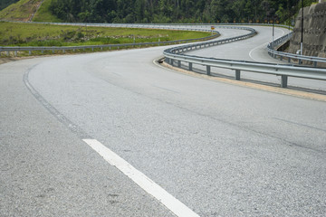 Obraz premium Close up asphalt curve road texture with white stripe