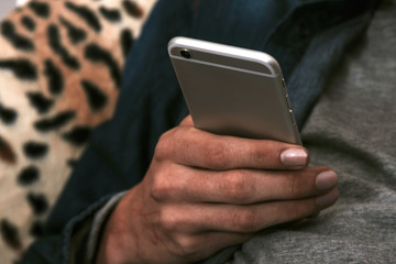 closeup of the hands with the mobile phone
