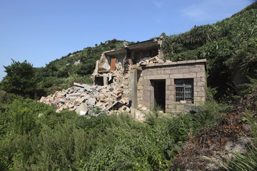 Fototapeta na wymiar an abandoned brick building enterprise house on top of mountain