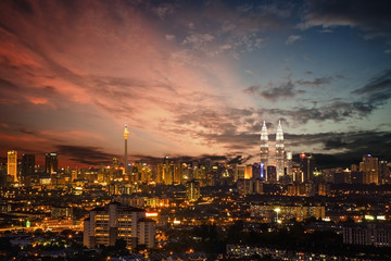 Kuala Lumpur, Malaysia city skyline during blue and red hour sun