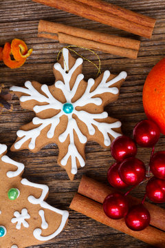 christmas gingerbread frosted snowflake cookie with spices and decorations close up
