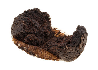 Double chocolate muffin that has been broken open on a white background.