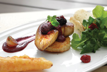 Close up of Foie Gras with red wine sauce. Selective focus.

