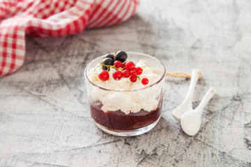cottage cheese with jam and berries on a table, selective focus