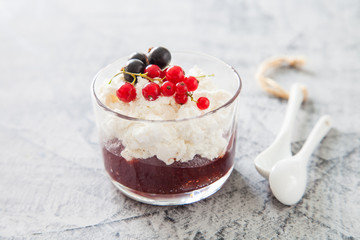 cottage cheese with jam and berries on a table, selective focus