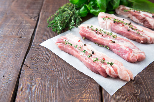 Raw meat. Pork ribs with herbs and spices
