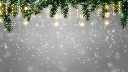 christmas background - twinkling snowfall on fir tee branches with fairy lights, copy space on...