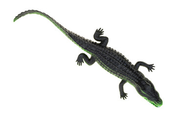 Toy alligator on a white background top view.