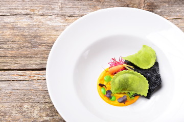 Fine dining, ravioli with pumpkin sauce