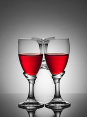 Two glasses of wine and one empty