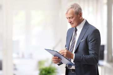 Senior professional man working in the office