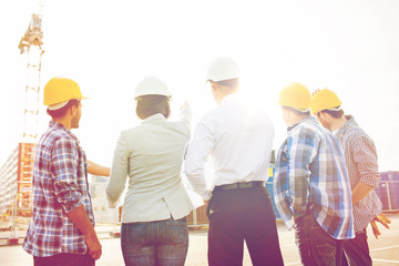 group of builders and architects at building site