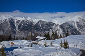 Fototapeta na wymiar Winter mountains panorama with ski slopes. Caucasus