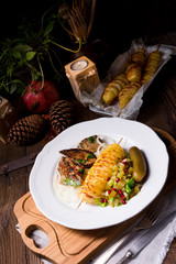 fried liver with fried potato and salt cucumbers