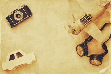 vintage toy plane, old photo camera, pilot glasses