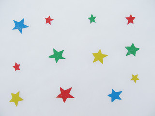 Colored paper stars on snow