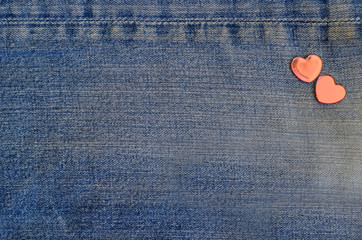 jeans love card. on jeans background laid two hearts. Backgrounds Valentine's Day. Wedding...