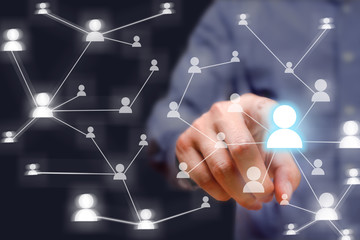 Businessman pressing social network button on modern digital dis