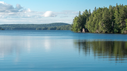 Cabin on a lake in Algonquin Provincial Park - Powered by Adobe