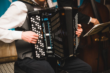 Man plays on large accordion © IVASHstudio