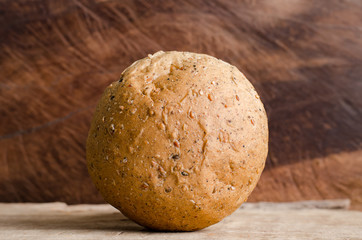 Whole wheat bread on wooden background,meal or breakfast